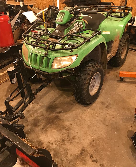 Arctic Cat ATV with plow